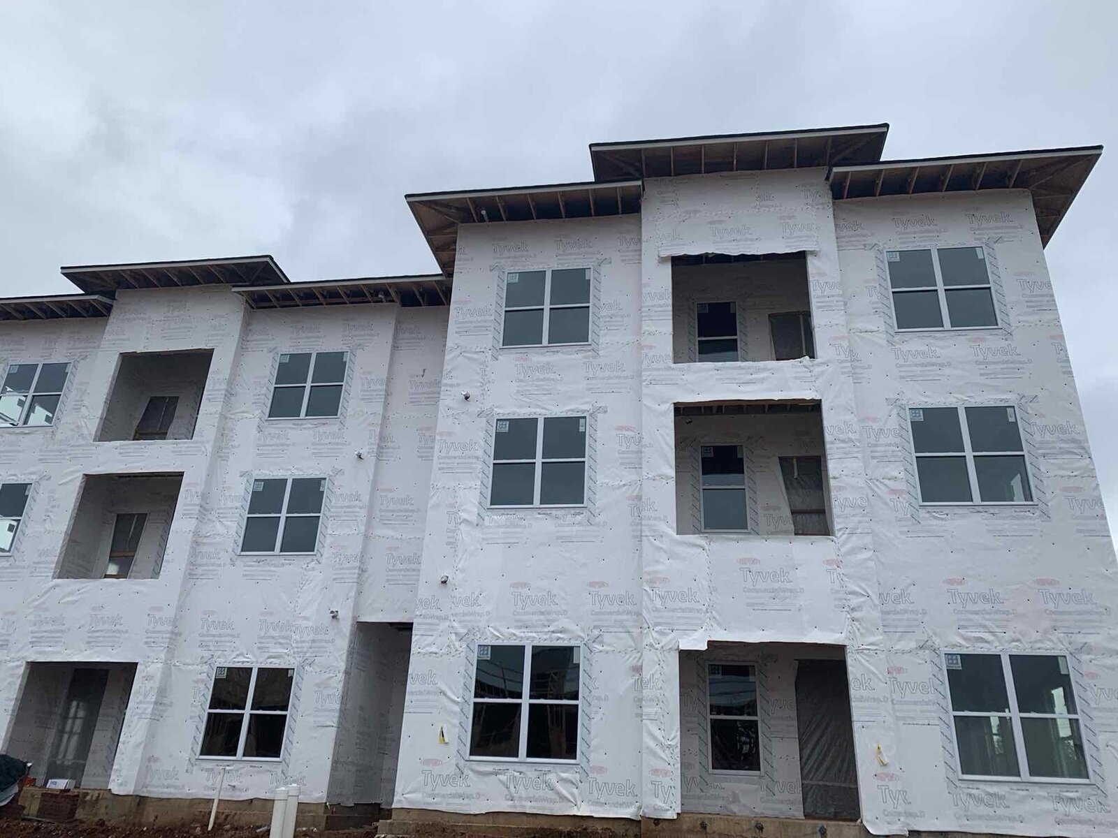 Multi-family building with completed stucco exterior finish