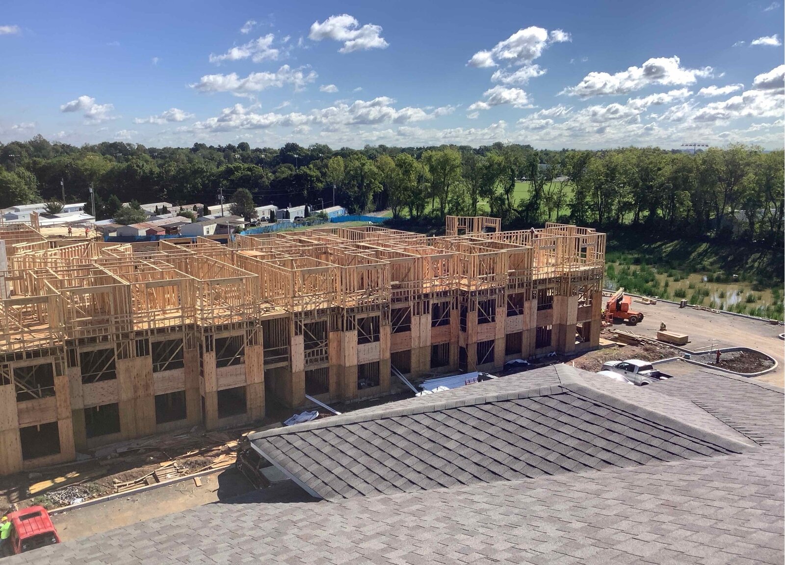 Aerial view of a multi-family townhome complex during active framing