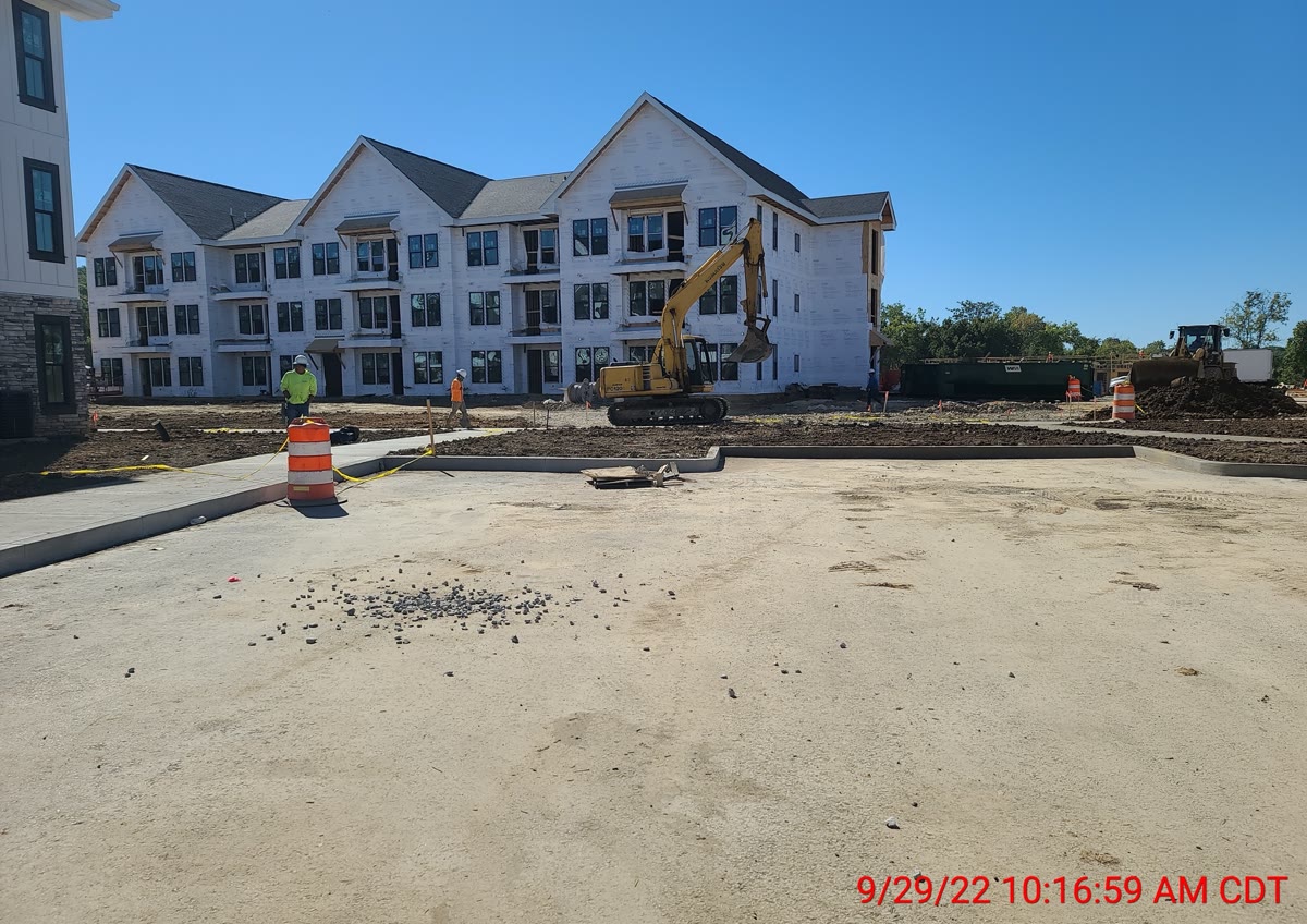 Completed multi-family building showing finished floor levels and exterior