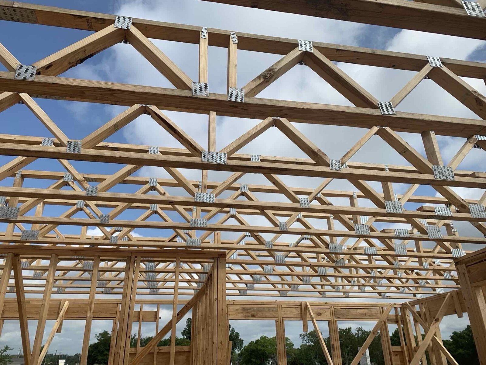 Close-up view of wood roof truss system during installation